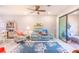 Spacious living area featuring a light and airy atmosphere with coastal decor at 18891 Lanuvio St, Venice, FL 34293