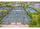Well-maintained tennis courts in a community setting at 18891 Lanuvio St, Venice, FL 34293