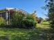 Screened patio, lush landscaping and flowering plants at 1890 San Trovaso Way, Venice, FL 34285