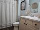 Clean bathroom with a shower/tub combo and updated vanity at 1890 San Trovaso Way, Venice, FL 34285