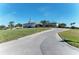 Community clubhouse with a golf cart area at 1890 San Trovaso Way, Venice, FL 34285