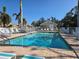 Inviting community pool with lounge chairs and a pool house at 1890 San Trovaso Way, Venice, FL 34285