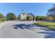 Community entrance with guardhouse and lush landscaping at 1890 San Trovaso Way, Venice, FL 34285