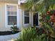 Front entrance with lush landscaping at 1890 San Trovaso Way, Venice, FL 34285