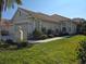 Two-car garage home with landscaping and walkway at 1890 San Trovaso Way, Venice, FL 34285