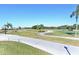 Scenic golf course view with lush greens and palm trees at 1890 San Trovaso Way, Venice, FL 34285