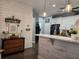 Modern kitchen with white cabinets and a breakfast bar at 1890 San Trovaso Way, Venice, FL 34285