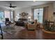 Living room with seating, hardwood floors, and dining area at 1890 San Trovaso Way, Venice, FL 34285