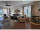 Living room with seating, hardwood floors, and dining area at 1890 San Trovaso Way, Venice, FL 34285