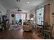 Living room with seating, hardwood floors, and dining area at 1890 San Trovaso Way, Venice, FL 34285