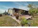 Spacious backyard with patio and mature landscaping at 1953 Settlement Rd # 14, Venice, FL 34285