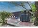Private backyard patio with grill and seating area at 1953 Settlement Rd # 14, Venice, FL 34285