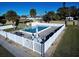 Inviting community pool with surrounding fence and seating at 1953 Settlement Rd # 14, Venice, FL 34285