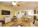 Open concept living and dining area with hardwood floors and a view of the kitchen at 1953 Settlement Rd # 14, Venice, FL 34285