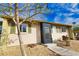 Tan house with green shutters, landscaping, and a walkway at 1953 Settlement Rd # 14, Venice, FL 34285