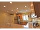 Open concept kitchen with stainless steel appliances and wood cabinets at 1953 Settlement Rd # 14, Venice, FL 34285