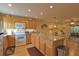 Kitchen with wood cabinets, granite counters, and stainless steel appliances at 1953 Settlement Rd # 14, Venice, FL 34285