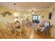 Open concept living area with dining table and seating area at 1953 Settlement Rd # 14, Venice, FL 34285