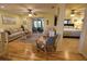 Bright living room with hardwood floors, comfy seating, and access to a screened porch at 1953 Settlement Rd # 14, Venice, FL 34285