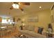 Living room with hardwood floors, comfy couch, and adjacent dining area at 1953 Settlement Rd # 14, Venice, FL 34285
