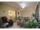 Sunroom with comfortable seating, a dining area, and string lights at 1953 Settlement Rd # 14, Venice, FL 34285