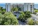 Condo building with lush landscaping and waterfront access at 2020 Harbourside Dr # 424, Longboat Key, FL 34228