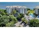 Waterfront condo building with pool and parking at 2020 Harbourside Dr # 424, Longboat Key, FL 34228