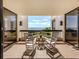 Relaxing balcony with rocking chairs and stunning water views at 2020 Harbourside Dr # 424, Longboat Key, FL 34228