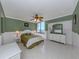 Primary bedroom with green walls and water views at 2020 Harbourside Dr # 424, Longboat Key, FL 34228