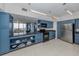Modern kitchen with blue cabinets and granite countertops at 2020 Harbourside Dr # 424, Longboat Key, FL 34228