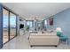 Living room with water views and comfortable seating at 2020 Harbourside Dr # 424, Longboat Key, FL 34228