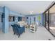 Relaxing living room featuring light blue walls and tiled floors at 2020 Harbourside Dr # 424, Longboat Key, FL 34228