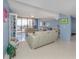 Bright living room with bay views and comfortable seating at 2020 Harbourside Dr # 424, Longboat Key, FL 34228