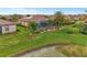 Aerial view of house with pool and lake view at 20323 Granlago Dr, Venice, FL 34293