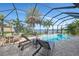 Large screened-in pool with spa and lake view at 20323 Granlago Dr, Venice, FL 34293