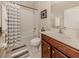 Clean bathroom with tub shower, toilet and vanity at 205 Carlino Dr, Nokomis, FL 34275