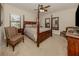 Main bedroom with a large bed, two night stands and ceiling fan at 205 Carlino Dr, Nokomis, FL 34275