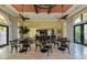 Community room with tables, chairs, and ceiling fans at 205 Carlino Dr, Nokomis, FL 34275