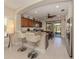 Kitchen with granite countertops, stainless steel appliances, and breakfast bar at 205 Carlino Dr, Nokomis, FL 34275