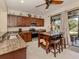 Kitchen with granite countertops, stainless steel appliances, and kitchen island at 205 Carlino Dr, Nokomis, FL 34275