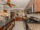 Kitchen with granite countertops and stainless steel appliances at 205 Carlino Dr, Nokomis, FL 34275