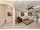 Spacious living room with a comfortable couch and recliner, ceiling fan and access to kitchen at 205 Carlino Dr, Nokomis, FL 34275