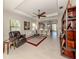 Spacious living room with leather seating, hardwood floors, and a view to the kitchen at 205 Carlino Dr, Nokomis, FL 34275