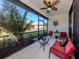 Relaxing screened porch with comfortable seating and outdoor views at 205 Carlino Dr, Nokomis, FL 34275