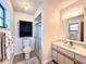 Updated bathroom with a walk-in shower, vanity, and toilet at 212 San Carlos Ave, North Port, FL 34287
