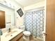 Clean bathroom with shower/tub combo and updated vanity at 212 San Carlos Ave, North Port, FL 34287
