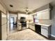 Kitchen with stainless steel appliances, white cabinets and light tile flooring at 212 San Carlos Ave, North Port, FL 34287