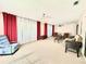 Spacious living room with ample natural light and seating area at 212 San Carlos Ave, North Port, FL 34287