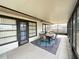 Relaxing screened porch with patio furniture and view of backyard at 212 San Carlos Ave, North Port, FL 34287