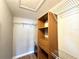 Large walk-in closet with wood shelving and wire racks for storage at 212 San Carlos Ave, North Port, FL 34287